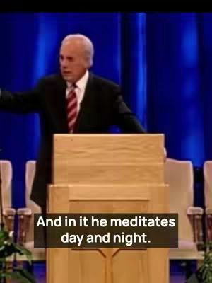 A man in a suit stands behind a wooden podium, gesturing with his right hand. The background is a gradient of blue, and a text overlay presents a quote from his sermon.