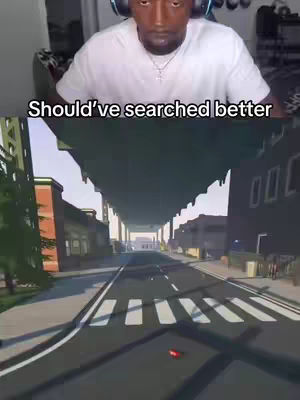 The cover image is split, with the top half showing a man wearing headphones, looking down with a serious expression, against a light background. The bottom half has a first-person view (FPV) of a video game street scene featuring a road, buildings, and a bridge.