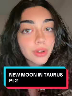 A selfie-style video cover image featuring a young woman with dark hair and light eyes. She appears to be speaking, with her mouth slightly open. Her skin has a natural tone, and she is wearing possible light makeup. The background is simple, but there is a text box in the bottom half with the words "NEW MOON IN TAURUS" and "Pt 2" on it. The overall layout is vertically oriented.
