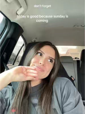 A woman in a car looks towards the upper right corner as if deep in thought. Text is overlaid at the top.