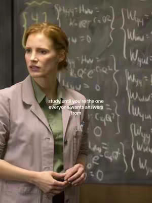 A woman in a lab coat stands in front of a chalkboard filled with mathematical equations. Text overlayed on the image reads motivational messaging.