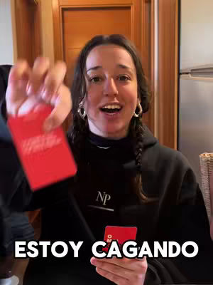 A young woman holds up two red cards, smiling widely and looking directly at the camera. Below her, bold white text reads a humorous statement.