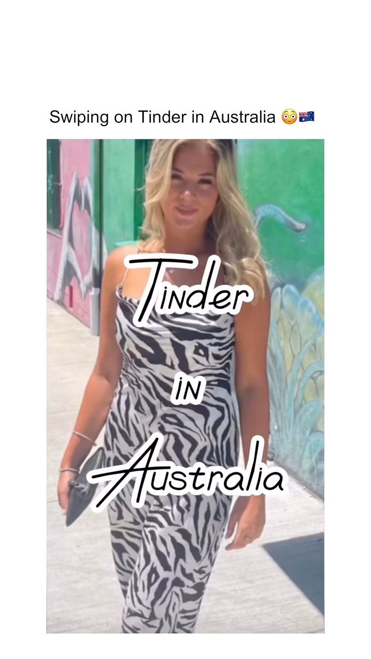 A woman with blonde hair stands in front of a wall, wearing a black and white zebra print outfit. Text overlays read 'Tinder IN Australia'. The image is framed vertically.