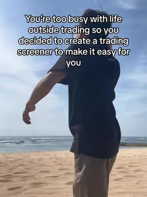 A person stands on a sandy beach with the ocean visible in the background under a clear sky. Text is overlaid on the image.