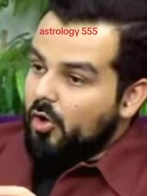 The cover image features a medium shot of a man with short, dark hair and a neatly trimmed beard against a slightly blurred green background, possibly a room. The man is looking to the side with an open mouth as if talking. Overlaid at the top is the text "astrology 555" in a red font. He wears a maroon shirt.