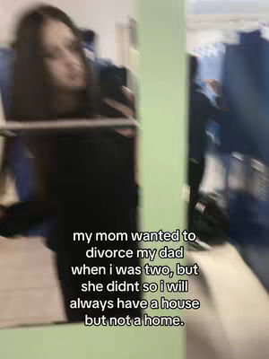 The cover image is a blurry selfie taken in a room with a mirror. A woman with dark hair is visible in the blurred foreground, holding the phone up and and looking down, as if taking a photo. The text is overlaid on the image with white text.