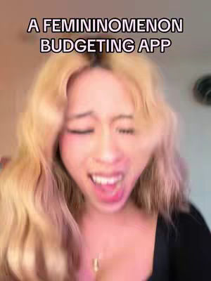 The cover image features a young woman with blonde hair in a close-up shot. She appears emotional, her eyes closed, and mouth open in what looks like a scream or exaggerated expression. The background is blurred, keeping the focus on her. A text overlay, 'A Feminimomenon Budgeting App' is added above her head.