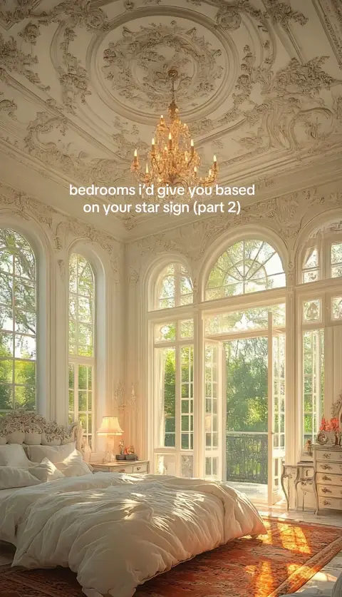 The cover image shows a luxurious bedroom with large windows and ornate architectural details. The room is bathed in natural light, creating a bright and airy atmosphere. A large bed with white bedding dominates the foreground, and a chandelier hangs from the ornate ceiling. The caption is centered and reads: bedrooms i'd give you based on your star sign (part 2).