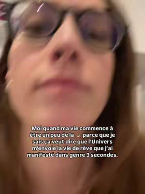 A blurry close-up shows a person wearing glasses, with text overlayed at the bottom. The text is in a sans-serif font, with white text on a slightly transparent background. The background is a blurred view of the person.