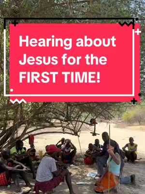 A cover image shows a group of people seated outdoors under a tree. Overlayed on the image is a red rectangular bar with white text that reads: 'Hearing about Jesus for the FIRST TIME!'. The scene is set in what appears to be a dry, semi-arid environment, with a few trees. The individuals are of African descent and dressed in a mix of casual and traditional clothing. They are gathered, some seated on the ground, listening to a person.