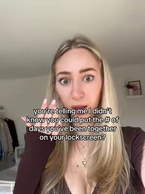 A woman with long blonde hair and a surprised expression on her face is the central focus. She is indoors, with a glimpse of a closet and a framed picture in the background. Text overlays are added to the image.