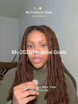 A woman with long, brown dreadlocks is centered in the frame, talking towards the camera. Above her, text reads 'My Financial Goals 2025 Edition.' Below, centered text says 'My 2025 Financial Goals.' In her hand she holds a small object. Below her, text reads 'going into the New Year not gonna lie'. The background is a blurred interior setting, possibly a room.