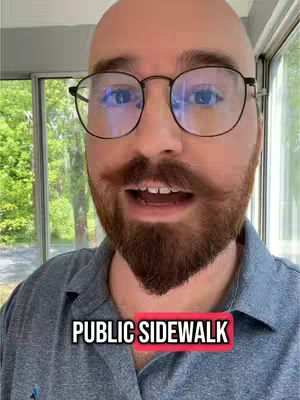 A close-up shot of a man with a bald head, wearing glasses, and a beard. He is looking directly at the camera with an open mouth expression. The text overlay "PUBLIC SIDEWALK" is at the bottom, set in a red background.