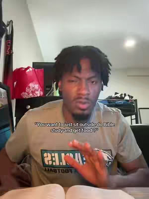 A dark-skinned man with short, black hair is the central figure, set against the backdrop of a room with a laptop and other items, with the textual overlay "You want to just sit outside do Bible study and get food?"