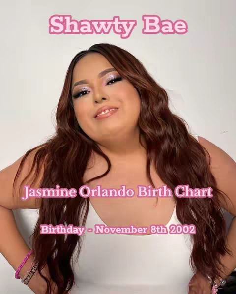 A medium shot features a woman with long, wavy brown hair. She is smiling, with a light makeup look. The background is a solid white. Overlayed text is present in pink, with the words, "Shawty Bae" at the top.