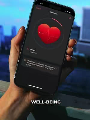 A hand holds a smartphone displaying the InPulse app. The app interface has a red heart graphic with a pulsing line, and a measurement indicator. The background outside is blurred and has a cityscape.