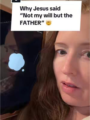 A young woman with long, wavy auburn hair looks toward the camera, with the lower half of a reflective screen visible on the left side of the frame. Text is overlaid on the top of the image in a white rectangular box that reads, "Why Jesus said \"Not my will but the FATHER\"".