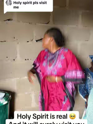 A woman in a vibrant pink dress is the central focus. She is seen in a medium shot, slightly blurred, with her back mostly to the camera. The background appears to be a textured wall. Overlay text at the top left features speech bubble with text and text at the bottom of the frame.