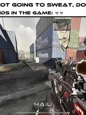 The image is a screenshot from a first-person shooter (FPS) video game. The scene is set outdoors, likely in an urban environment such as a shipping yard or industrial area. The primary focus is a first-person view of a gun, held in a player's hands. The game's user interface (UI) is visible, including a targeting reticle. The background shows a maze of shipping containers and industrial structures. The color palette is muted, fitting the game's realistic aesthetic.