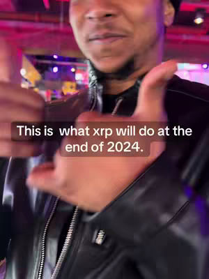 The cover image shows a man giving a thumbs-up while looking at the camera. He is wearing a black leather jacket and the text overlay reads, "This is what xrp will do at the end of 2024."