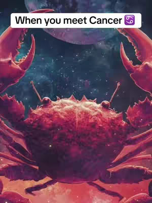 The image is a stylized illustration with a predominantly purple and red color scheme, featuring a large crab in the center with prominent claws extending on either side. The crab's body has a textured, possibly metallic, appearance. In the background, a starry night sky is visible behind the crab, and a faint celestial body floats above. The top of the image contains a white banner with the words 'When you meet Cancer' and astrological symbol.