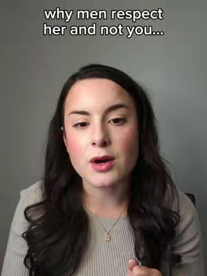A woman with long dark hair, fair skin, and wearing a light colored top is looking directly at the camera. The background is a plain, light gray wall, and overlaid text appears at the top.