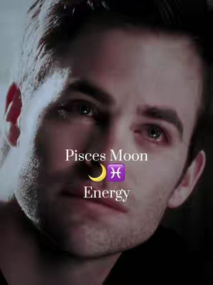 A close-up shot of a man's face, highlighting his upper chest and head. The man has short, dark hair and a slight shadow of stubble. The lighting is soft, and the background gradient fades from a darker hue near the bottom to a lighter one near the top. Overlayed on the image are text elements, creating a layered composition that focuses on astrology.