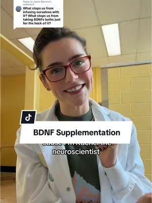 A woman with fair skin, wearing red-rimmed glasses and dressed in a white lab coat, smiles directly at the camera against a blurred indoor background. A light-colored text box with the words "BDNF Supplementation" is superimposed midway down the image. Below, smaller text, presumably the creator's name and profession, reads "cause imkracher the neuroscientist."