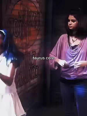 The cover image shows two figures from the waist up set in a dark environment. On the left, a person with blue hair, wearing a white dress, appears to be slightly bending backward. On the right, another person wearing a pinkish-purple top and dark pants is standing and looking down. The text 'taurus core' is overlaid on the image.