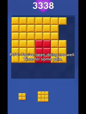 The image shows the Block Blast game interface. The top section displays a score of 3338 in a purple circle. Below, a grid of golden blocks with a red section in the center forms a puzzle. White text overlays the puzzle, saying 'POV: You've been doing too well. Time for some pain.'. At the bottom are templates for additional blocks in game. The background is a solid blue.