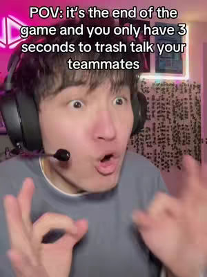 The cover image is a close-up shot featuring a young man with short, dark hair. He is wearing a gray crew-neck t-shirt and a large black headset with a microphone. His facial expression is one of exaggerated surprise and excitement, with wide eyes and his mouth open in an 'O' shape. The background of the image is slightly blurred, suggesting this is a selfie.