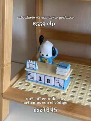 A cover image of a wooden shelf with a cartoon calendar in the center. The calendar features a Pochacco figure on top of a desk, with text overlays indicating the date and price. The background suggests a casual setting.