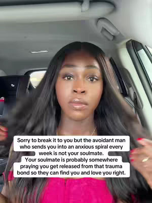 A selfie-style video taken from inside a car. The foreground shows a woman with long, dark hair and a serious expression. Her skin is smooth, and she appears to be looking directly at the camera. She is wearing a pink top. Behind her, the interior of the car is visible. There is text overlaid on the image in a white box, which seems to be the main focus of the video.