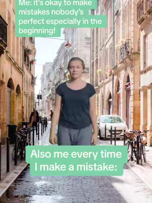 A woman stands in a European street scene. The image is framed like a meme, with text boxes overlayed. The woman is wearing a dark blue t-shirt and gray pants. The background features buildings on both sides of the street.