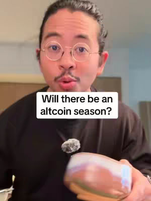 A medium shot of a man, wearing glasses, looking directly at the camera with slight smile. The phrase 'Will there be an altcoin season?' is imposed on a white rectangle over his chest.