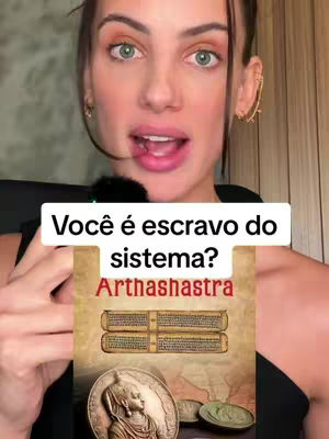 A woman with brown hair and green eyes is the main focus of the video cover image. She is looking towards the camera while holding up a sign and is wearing a black colored outfit. The sign consists of three layers with a question on the top, then a second layer, and an image on the bottom of the sign.