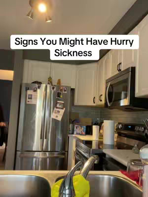 A kitchen interior with stainless steel appliances and white cabinets; a text overlay reads 'Signs You Might Have Hurry Sickness'.