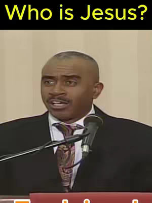 The cover image features a medium shot of a Black man dressed in a suit, speaking into a microphone. Above him is a black bar with yellow text that reads, "Who is Jesus?". The background appears to be an interior setting with an indiscernible backdrop.