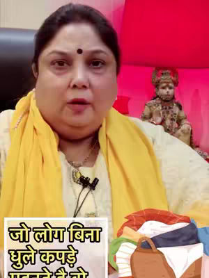 A woman in a yellow scarf poses, with a background that includes religious elements and a pile of clothes.