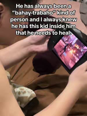 Person holding a Steam Deck while lying in bed with text overlay.