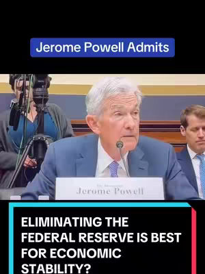 The cover image shows a man in a suit speaking into a microphone with text overlays. The man, Jerome Powell, is at the center, partially cut off at the bottom, with a sign in front of him. The text overlays inform the viewers about content. The overall tone is serious, with the use of bold, white text against a black background which draws the viewer’s eyes.