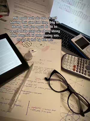 The cover image shows a cluttered desk with a laptop, various papers covered in handwriting and diagrams, an e-reader, glasses, a calculator, and a pen. The text is overlaid on top.