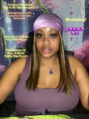 A woman with a purple headscarf and tank top is directly facing the camera. Text overlays provide context relating to relationships and tarot readings. The background appears to be a digitally enhanced setting, with soft pink and purple hues.