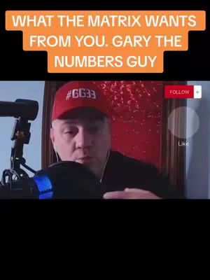 The image features a man in a red cap with the hashtag #GG33, facing the camera with a microphone in front of him. Overlayed text in an orange box reads 'WHAT THE MATRIX WANTS FROM YOU. GARY THE NUMBERS GUY'. The background shows a framed artwork and a red back wall. The overall composition is a selfie-style video.