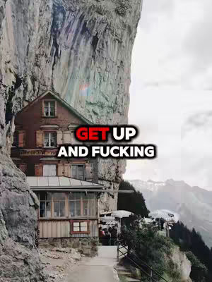 A building is nestled into the side of a cliff face with a path and railing leading towards it. The text overlay is bold indicating encouragement.