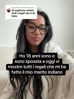 A selfie-style video cover with a woman in the center, wearing glasses and looking at the camera. A black banner at the bottom contains white text. Above the woman's head, there the image of a chat bubble with text in it.