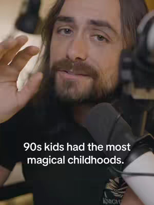 A man with a beard and shoulder-length hair appears in front of a microphone. Text overlays the image.