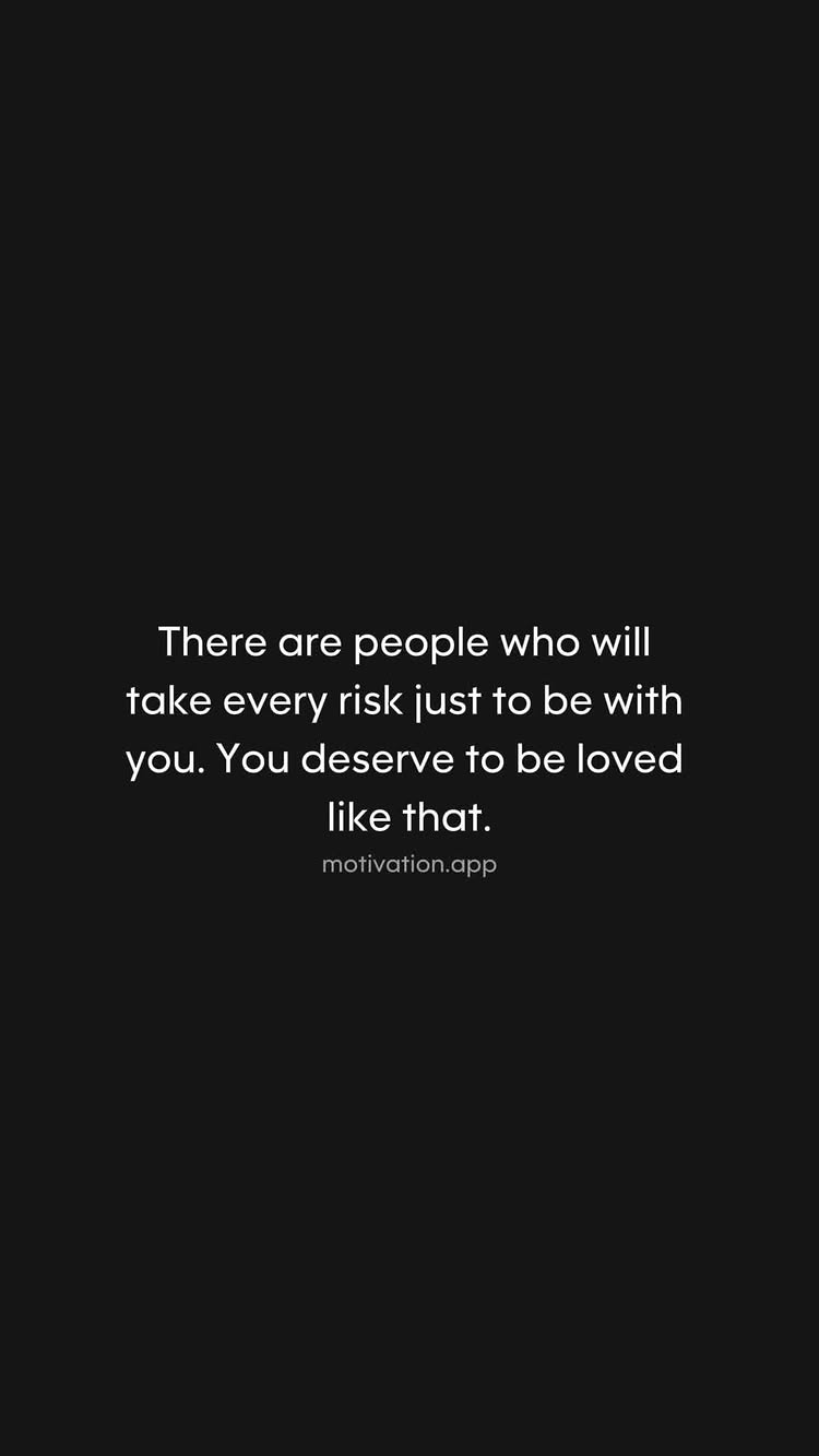An image with a plain black background. Centered on the image, in white text, is a motivational quote about love, with the website `motivation.app` at the bottom.