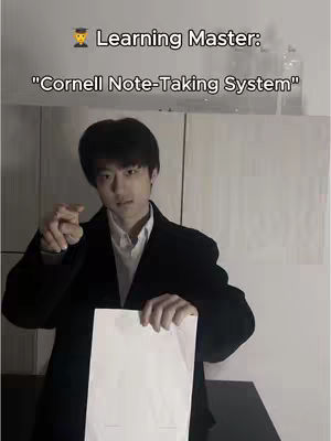 A young man in a black coat holds a blank white paper, pointing with his other hand. Text overlaid at the top states 'Learning Master' and 'Cornell Note-Taking System' suggesting a study method.