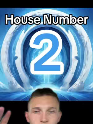 A man’s face is seen from the chest up with a blue and white design over his head and the words "House Number" and the number "2" in the middle of the frame